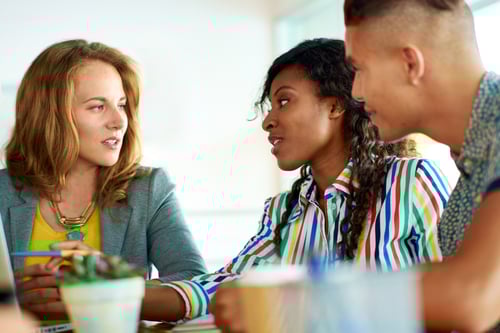 Candid image of a group with succesful business people caught in an animated brainstorming meeting Candid image of a group with succesful business people caught in an animated brainstorming meeting